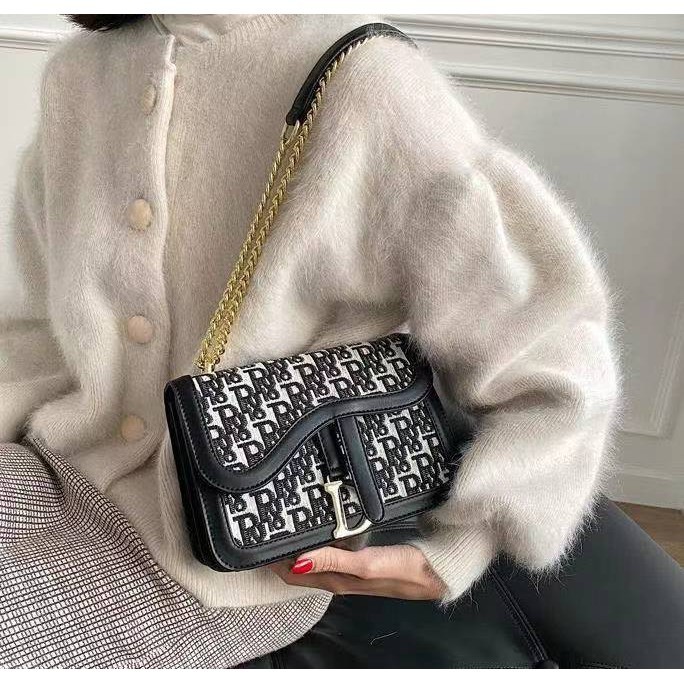 AW MEDIUM FLAP SLING BAG WITH INCLUSION